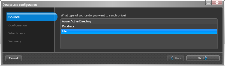 Data source configuration dialog in the Genetec ClearID™ One Identity Synchronization Tool showing Source settings page with File selected.