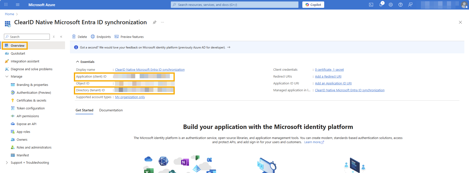 La página de información general de la aplicación empresarial en el portal web de Azure con el ID de inquilino y el ID de aplicación resaltados.